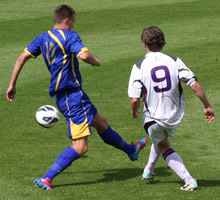 Two football players in action